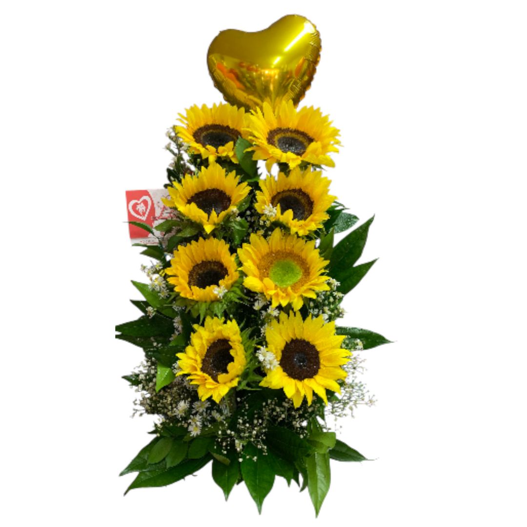 Arreglo lineal de girasoles con globo metálico dorado.